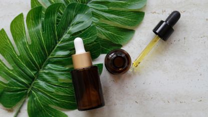 two serum bottles flat lay with leaf
