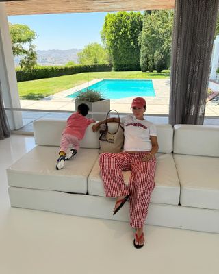 woman wearing oversize shirt with striped pants