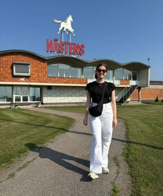 Emilia standing outside the Hästens factory.