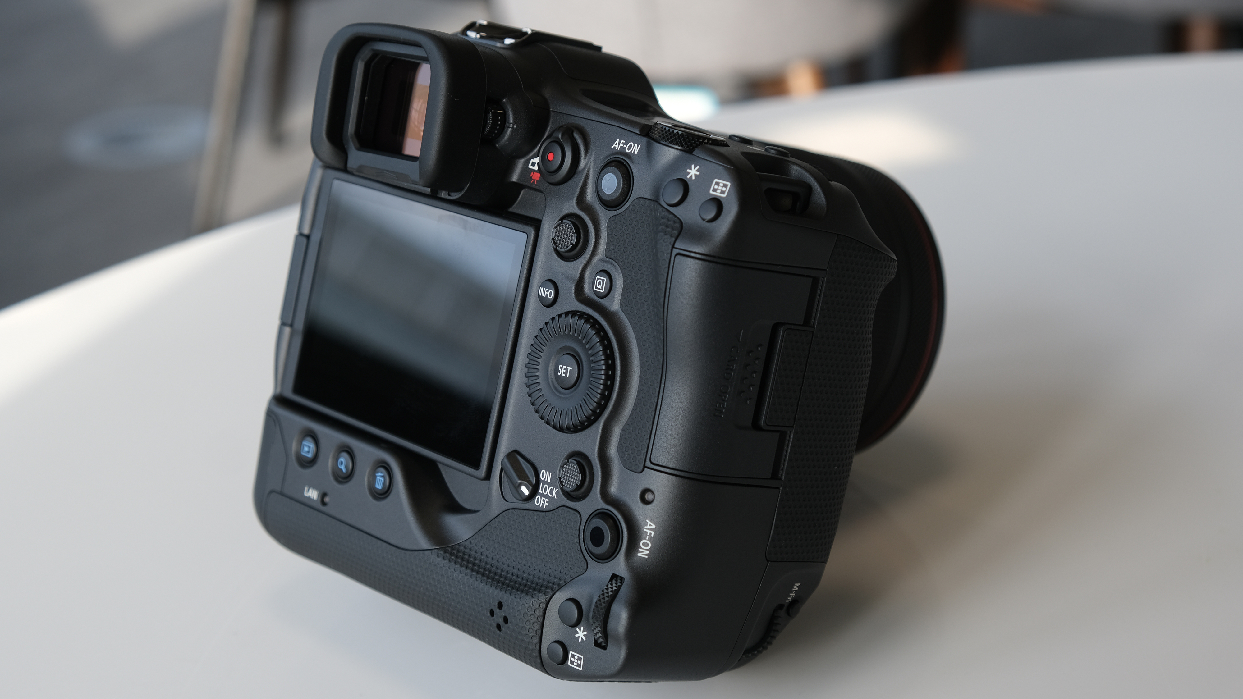 The back of the Canon EOS R3 mirrorless camera on a table