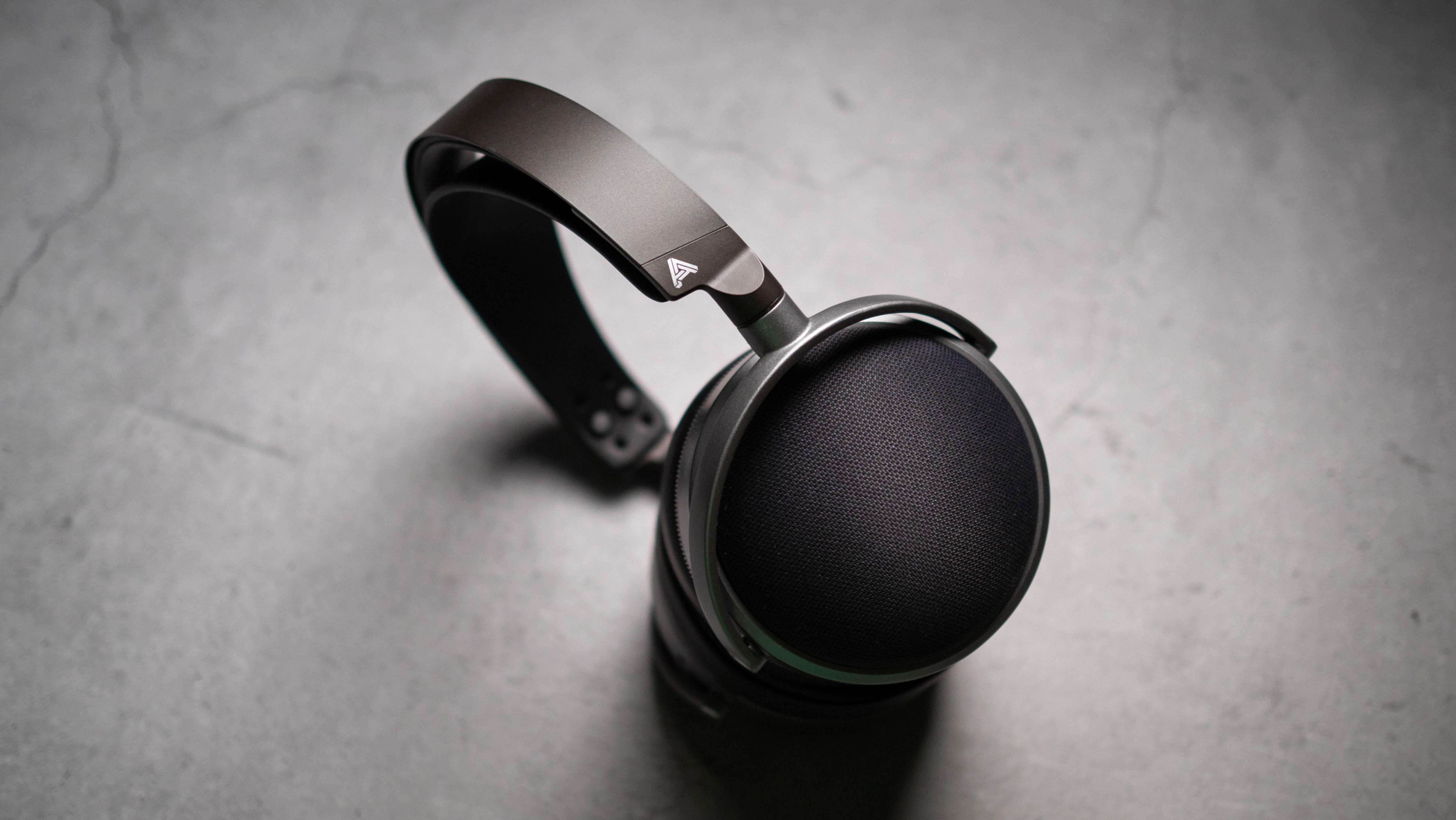 Audeze LCD-S20 planar headset in front of gray kraft sheet highlighting product design