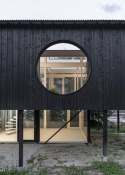 Timber facade with circular opening