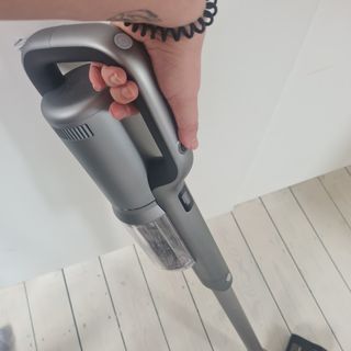 Hand holding the Roidmi RS60 mopping wood floors