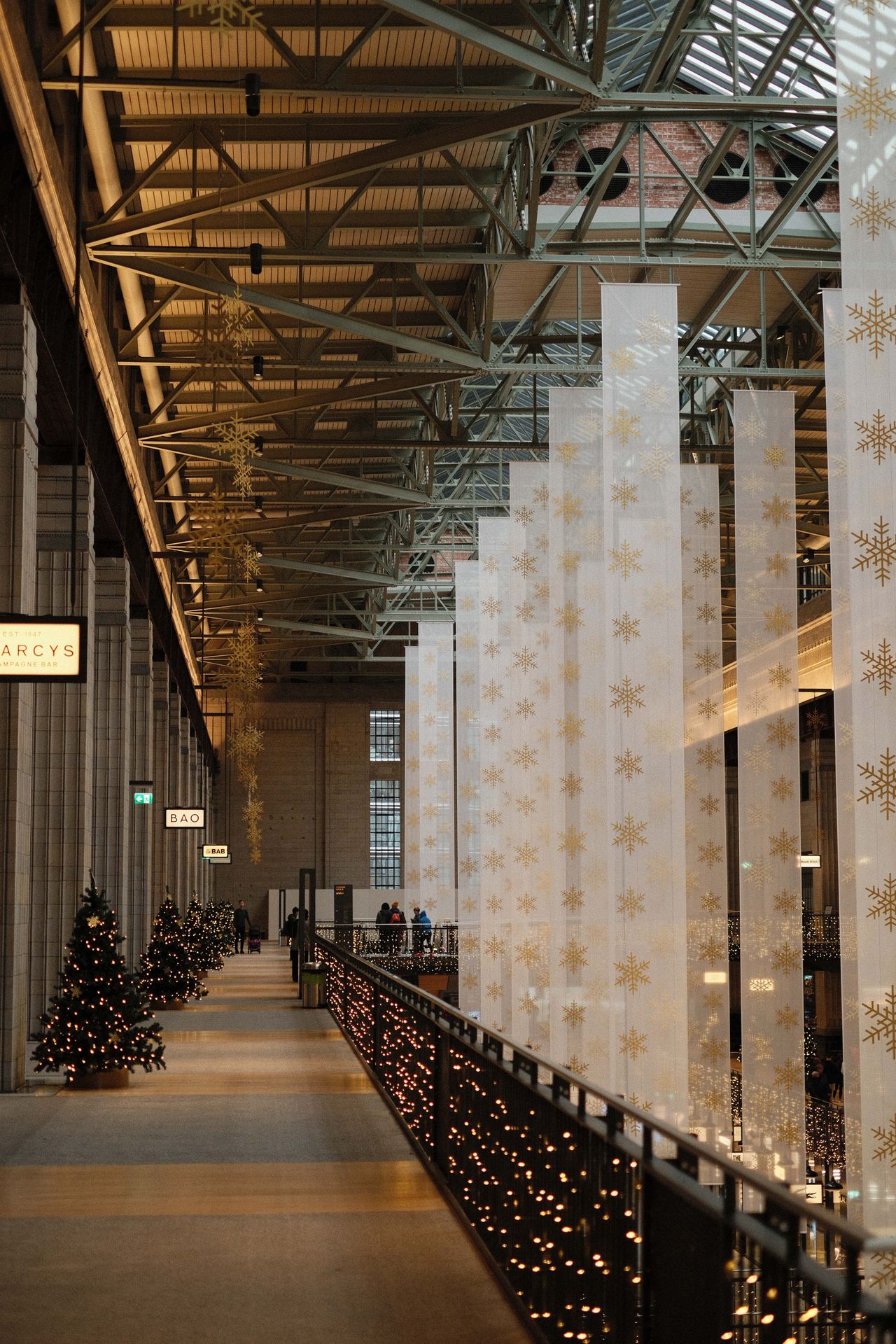 Battersea power station with Christmas decorations hung from the rafters