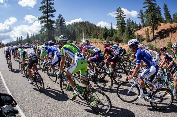 Riders get out of the saddle on another of todays rollers