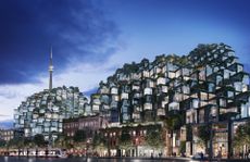 King Toronto by Bjarke Ingels Group. Large apartment buildings with a stepped design above a town on the water.