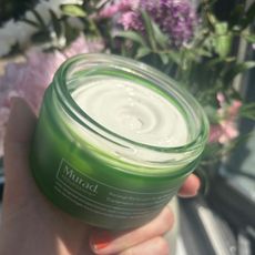 an open tub of murad resculpt body treatement in the sunshine