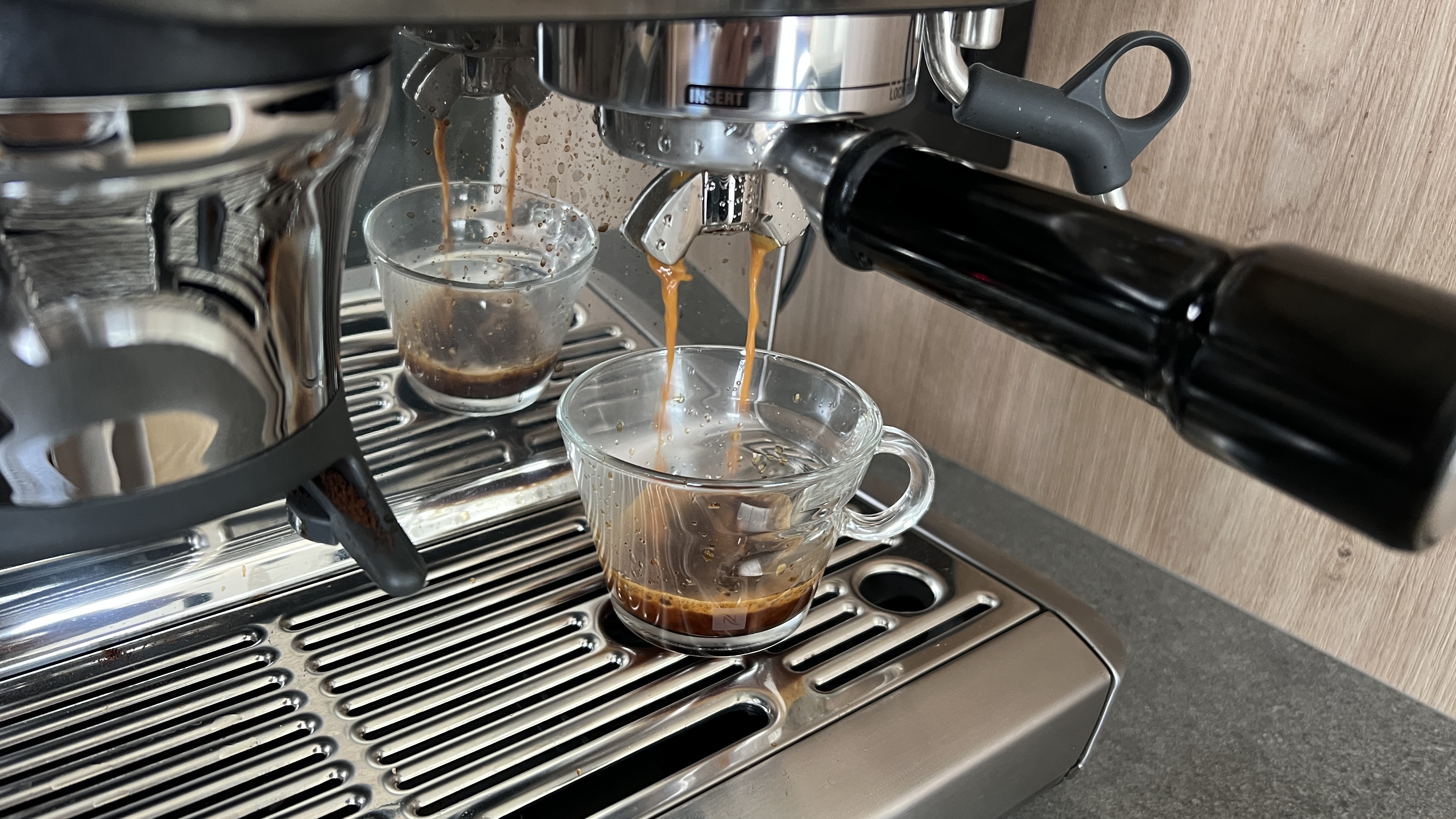 pouring espresso from machine