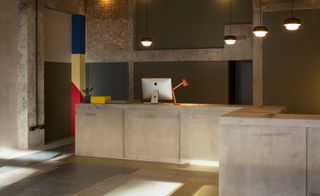The project is the renovation of an old brutalist brewery building.