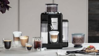 De'Longhi Rivelia coffee machine with various coffee drinks on kitchen counter