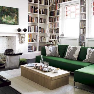 white walls with bookshelves and sofa