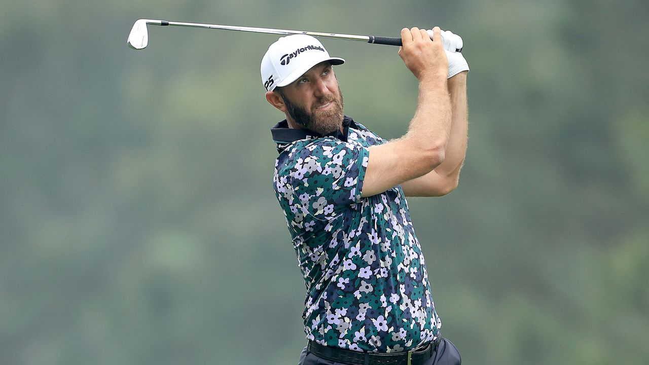 Dustin Johnson hits an iron shot during Masters practice