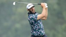 Dustin Johnson hits an iron shot during Masters practice