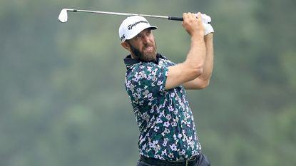 Dustin Johnson hits an iron shot during Masters practice