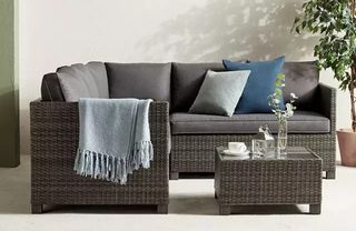 A rattan corner sofa from John Lewis & Partners