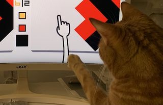 A cat reaches out for the hand cursor
