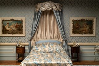 a bed from Bridgerton in blue