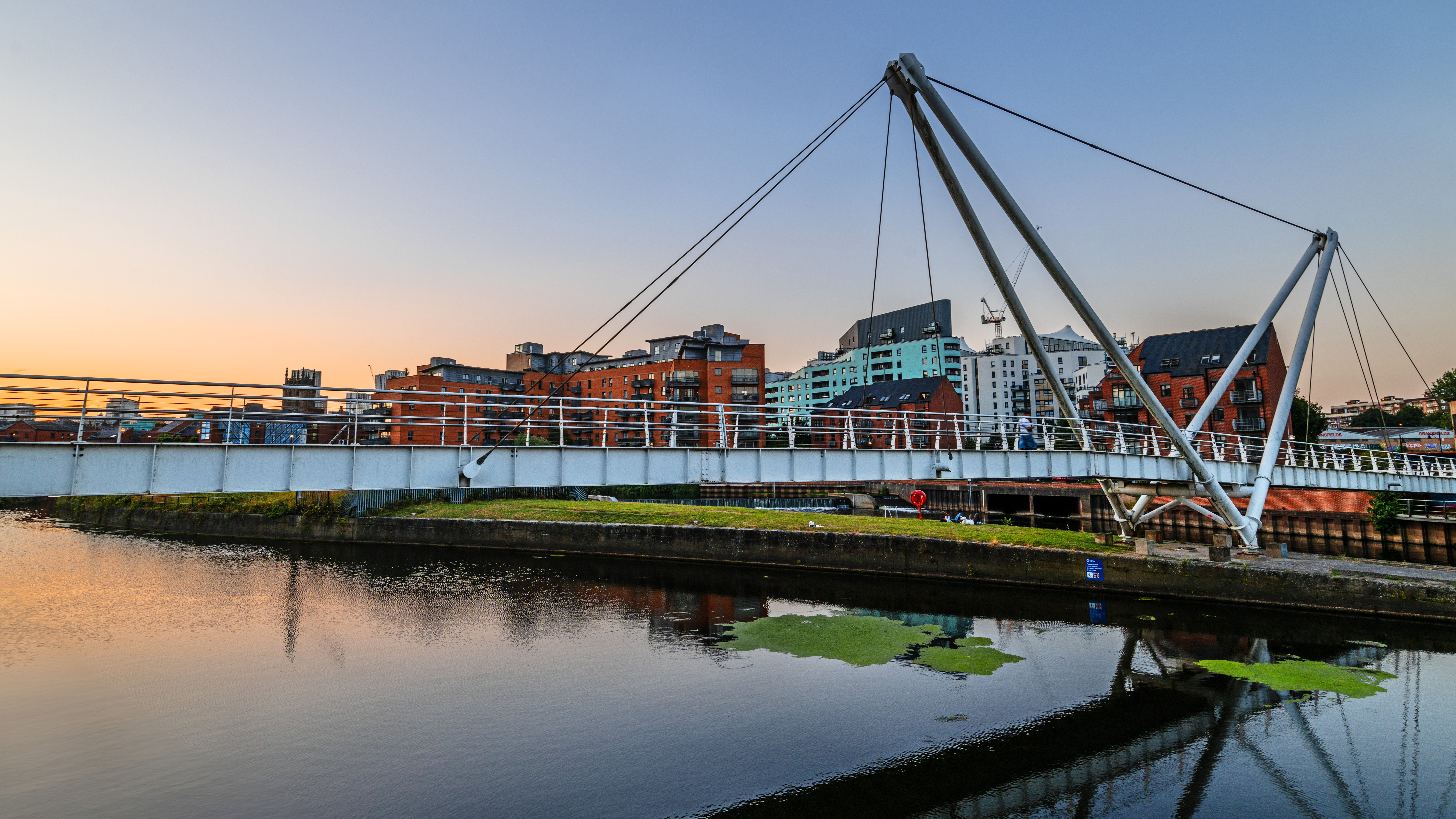 Shooting into the sun usually requires a graduated ND filter. An aperture of f/8 was fine, with focussing on the bridge
