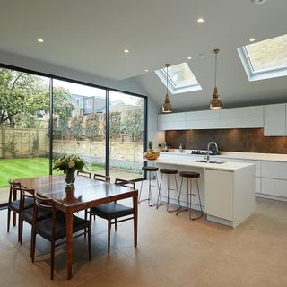 kitchen room with tiled flooring and wooden table with chairs