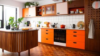 retro orange kitchen with curved island