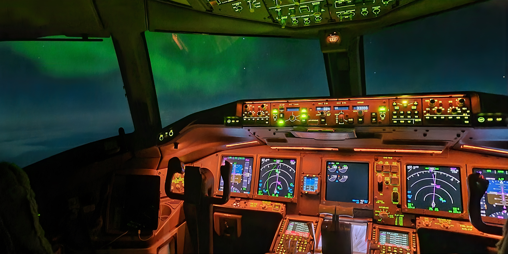 A photograph taken by pilot Ralf Rohner of the aurora outside the cockpit