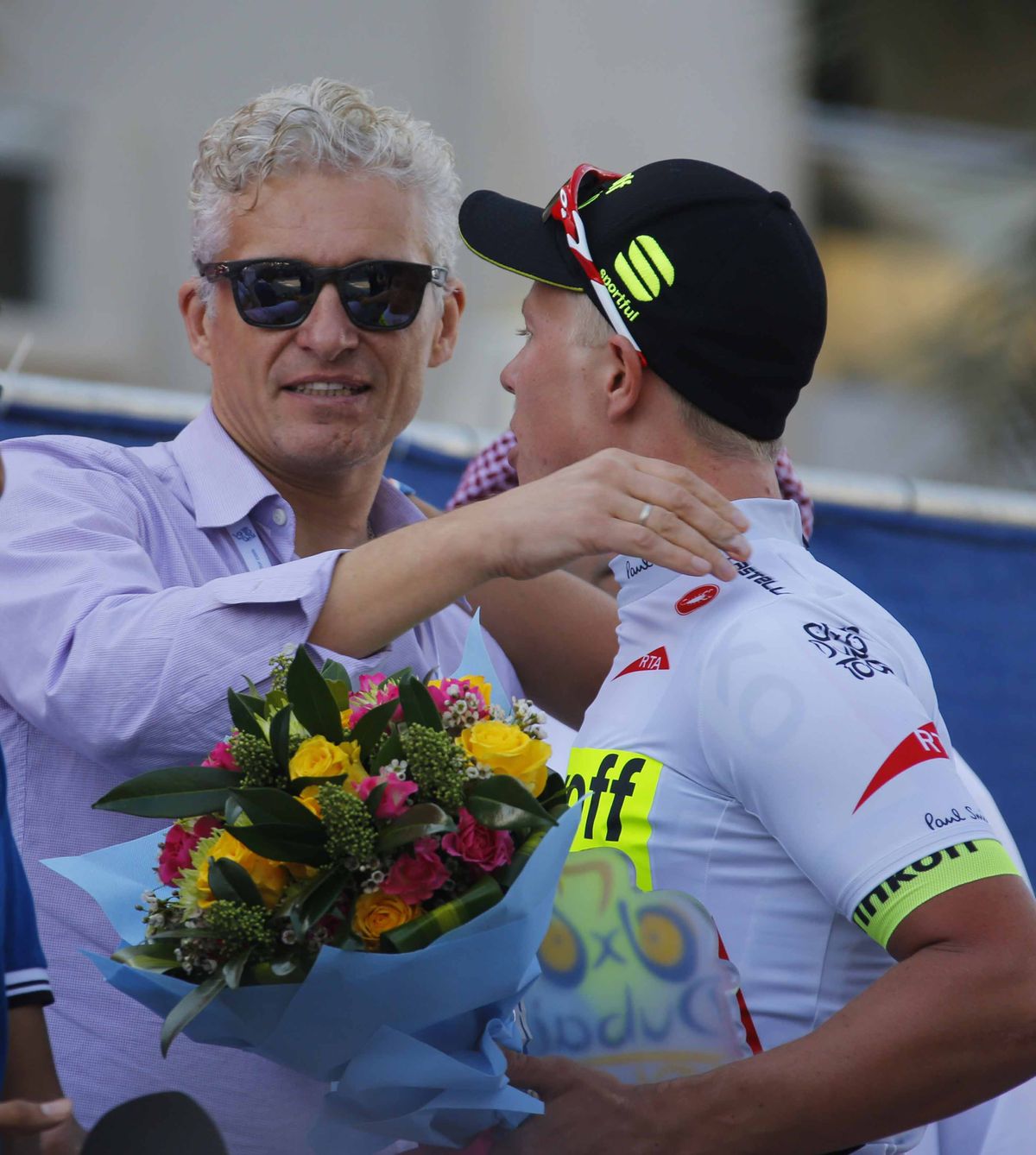 Oleg Tinkov congratulates Michael Valgren Andersen on winning the white jersey at the Dubai Tour.