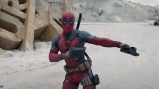 Deadpool reloads in front of a crumbling Fox logo in Deadpool & Wolverine.