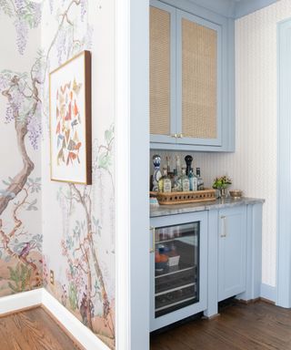 home bar with blue cabinets and rattan cupboard doors