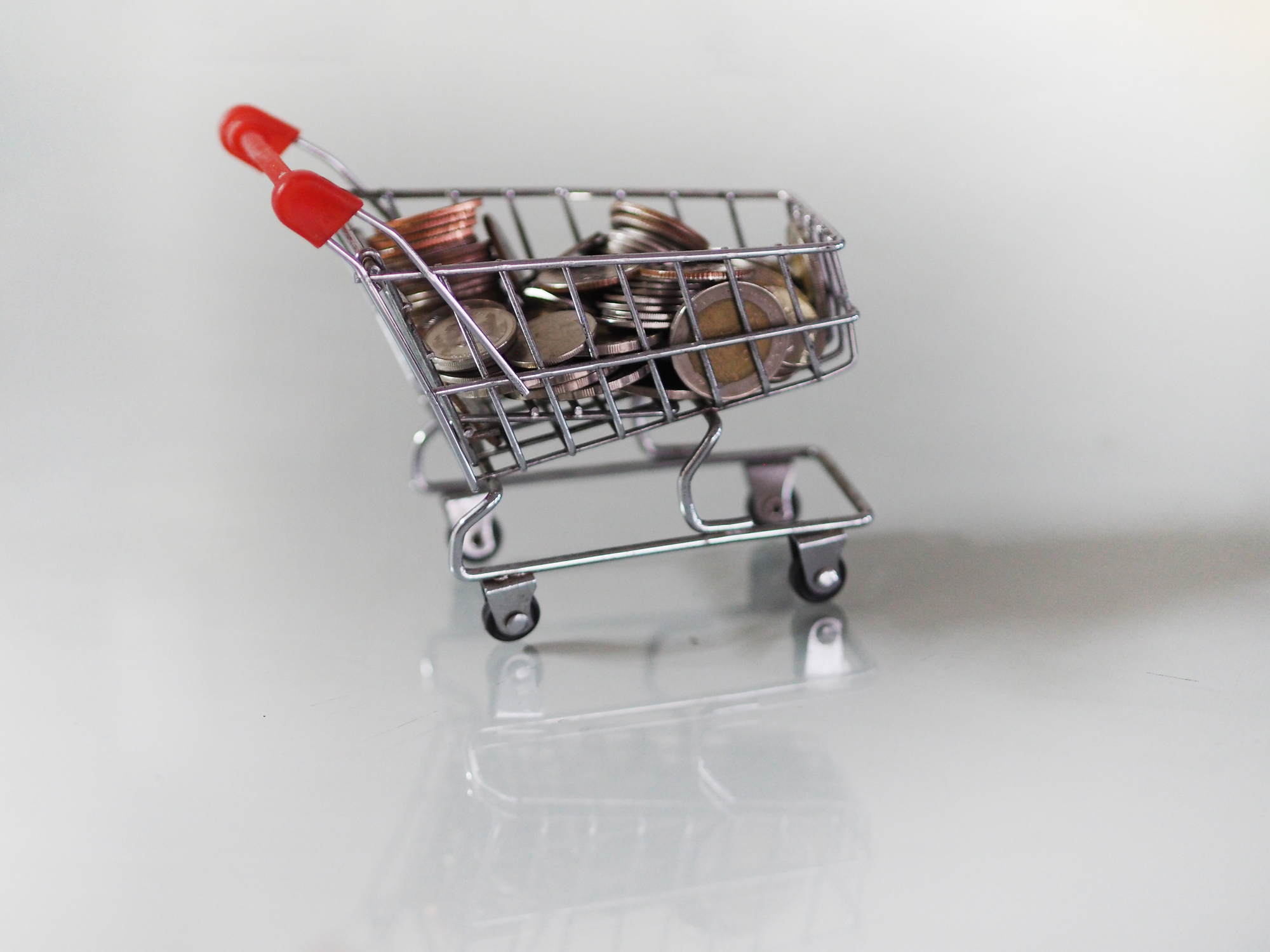 shopping cart full of coins