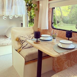 caravan interior with wooden dining area