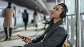 Sony WH-1000XM5 wireless headphones on a man's head