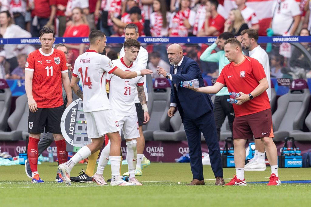 Michael Gregoritsch (AUT), Jakub Kiwior (POL), Nicola Zalewski (POL), and Coach Michal Probierz (POL) are participating during the Poland vs. Austria match UEFA Euro 2024 in Berlin, Germany, on June 21, 2024. (Photo by Foto Olimpik/NurPhoto via Getty Images)