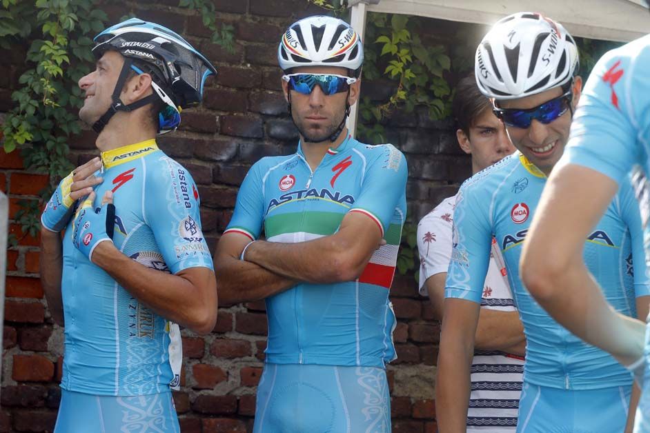 A focused looking Vincenzo Nibali waits with his teammates