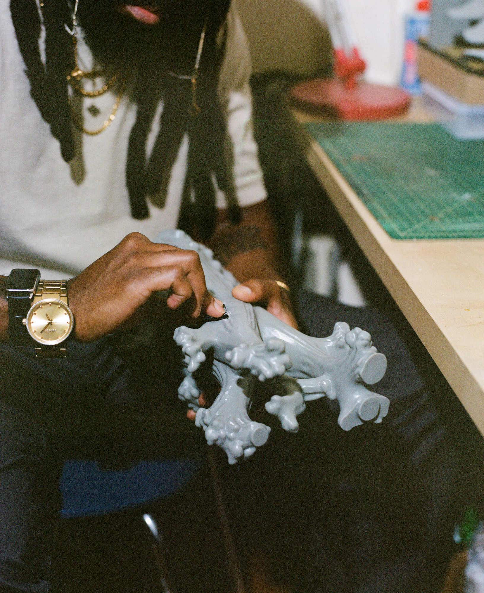 Artist Olaleken Jeyifous and his works in the studio