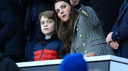 Catherine, Duchess of Cambridge speaks to their son Prince George of Cambridge prior to the Guinness Six Nations Rugby match between England and Wales at Twickenham Stadium on February 26, 2022 in London, England.
