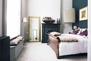 Bedroom carpet bed lighting fireplace mirror floor lamp cushions artwork