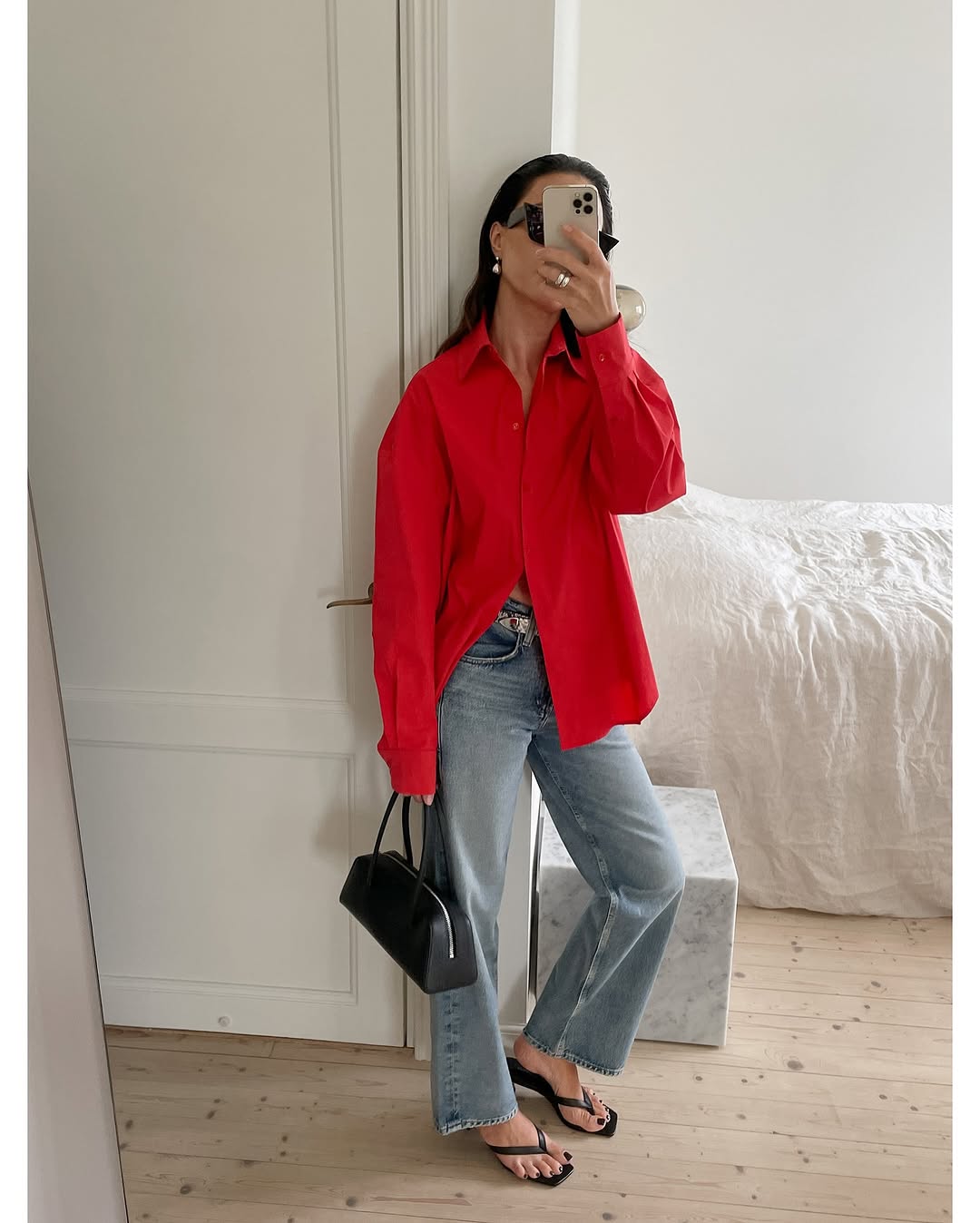 woman wearing holiday denim outfit 2025