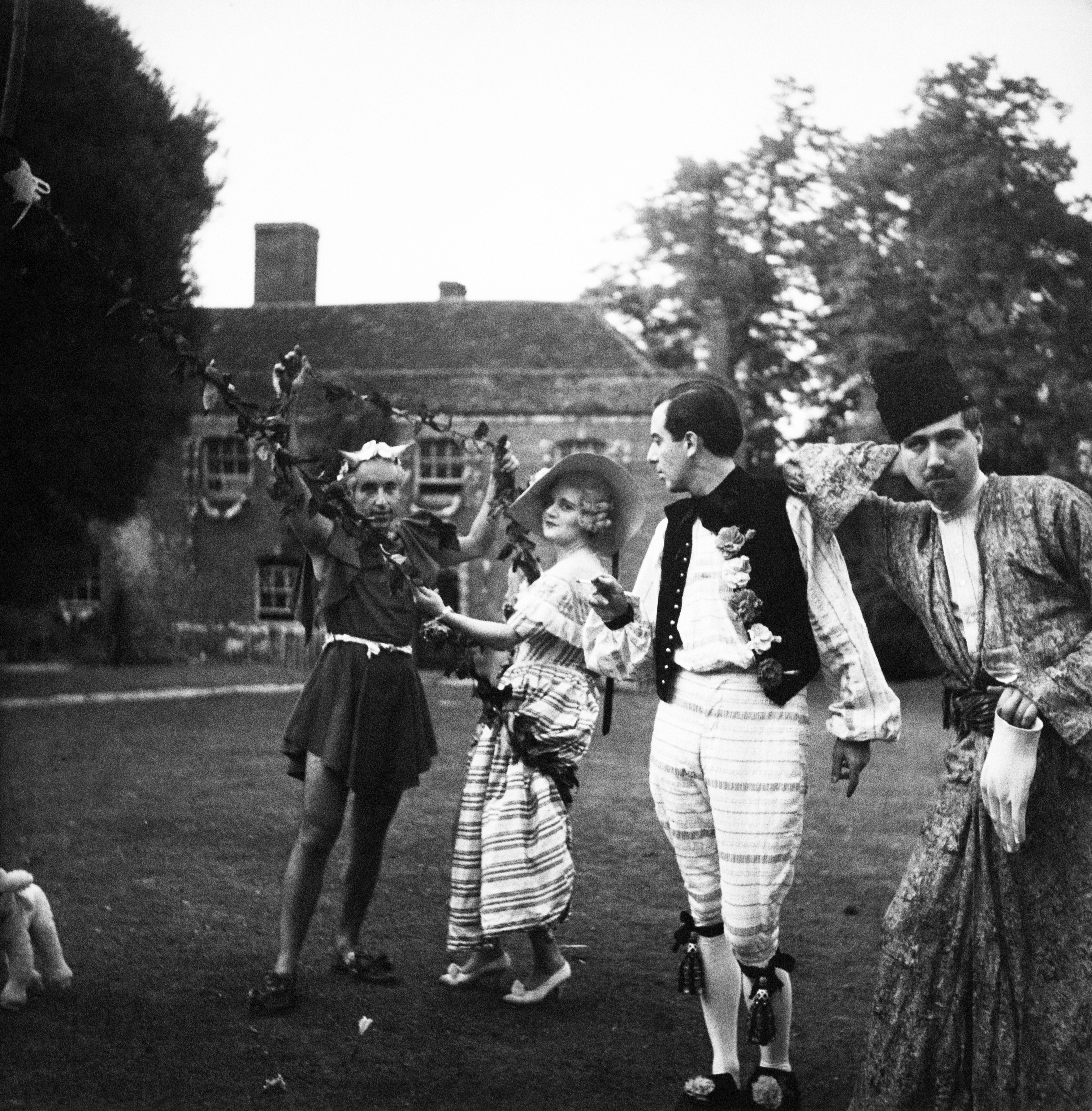 People in costume at Cecil Beaton’s Ashcombe House for the Fête Champêtre by Cecil Beaton