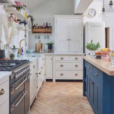 White kitchen with navy island
