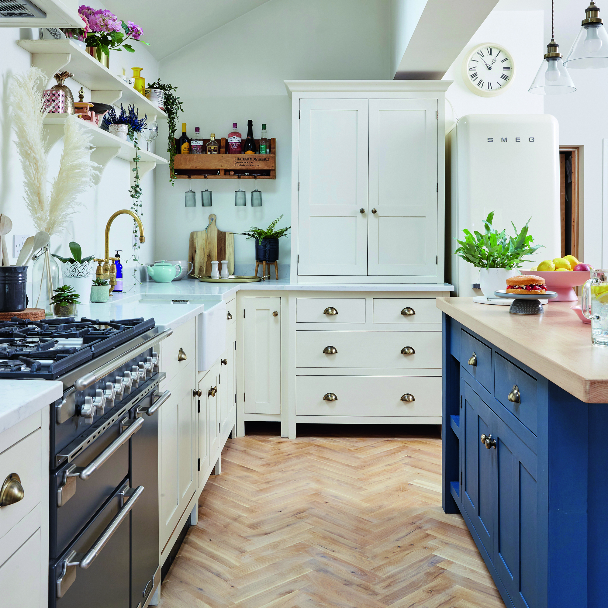 White kitchen with navy island
