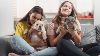 Two girls with Frenchies