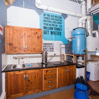 lab with wooden cabinet and metal sink