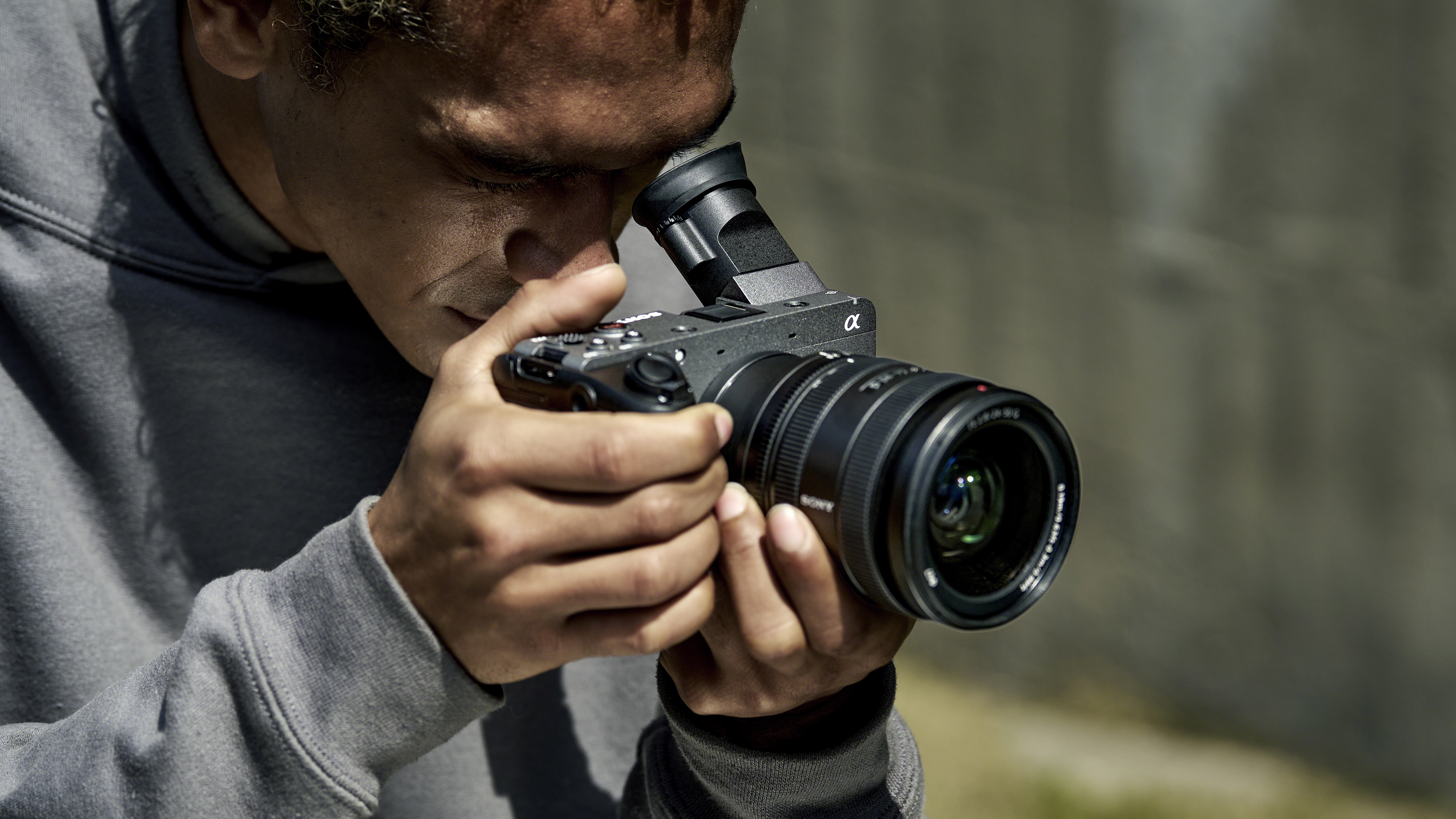Sony FX2 camera in a person's hands