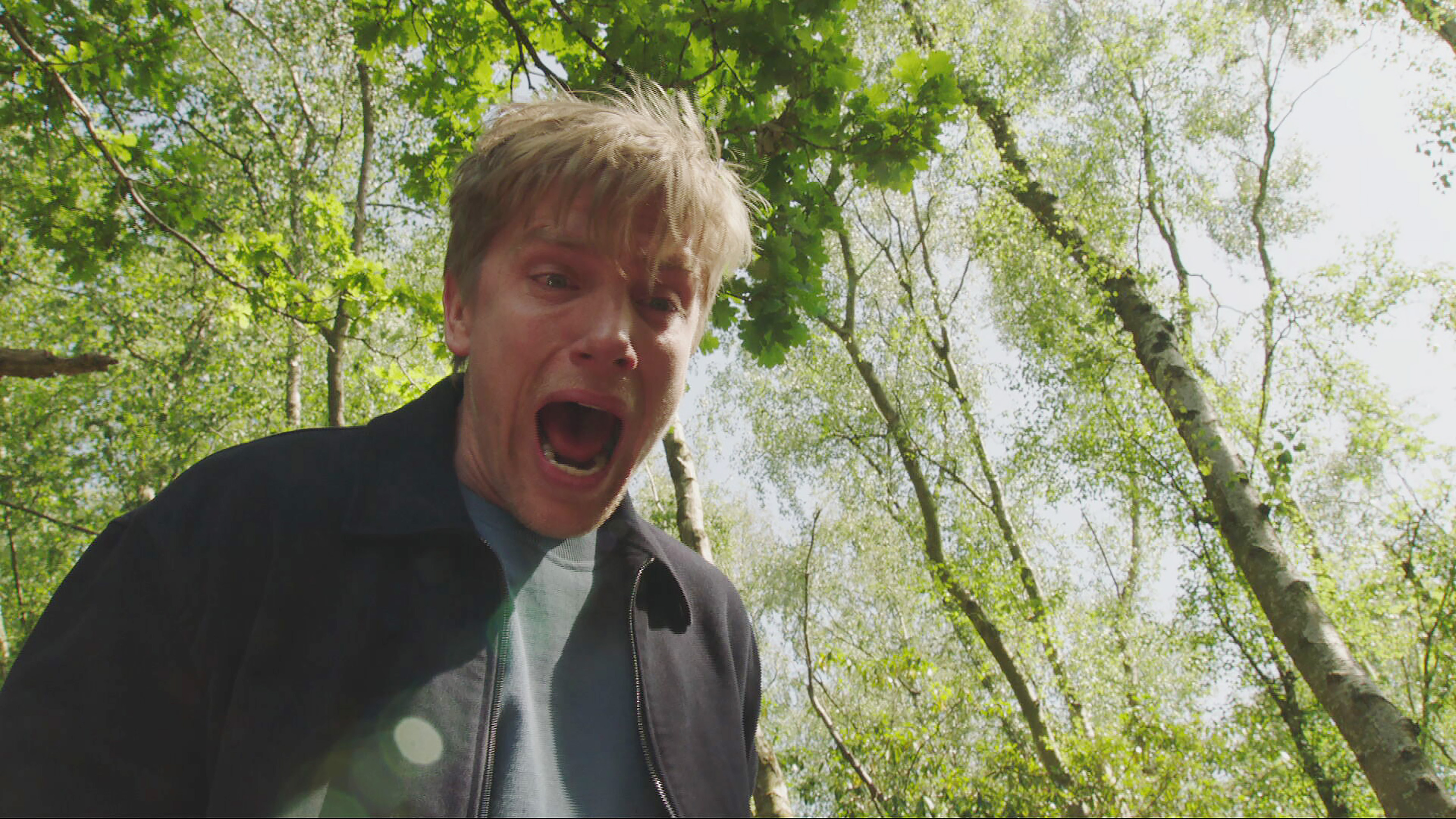 Robert looks over the cliff&#039;s edge and sees Aaron and John&#039;s lifeless bodies below