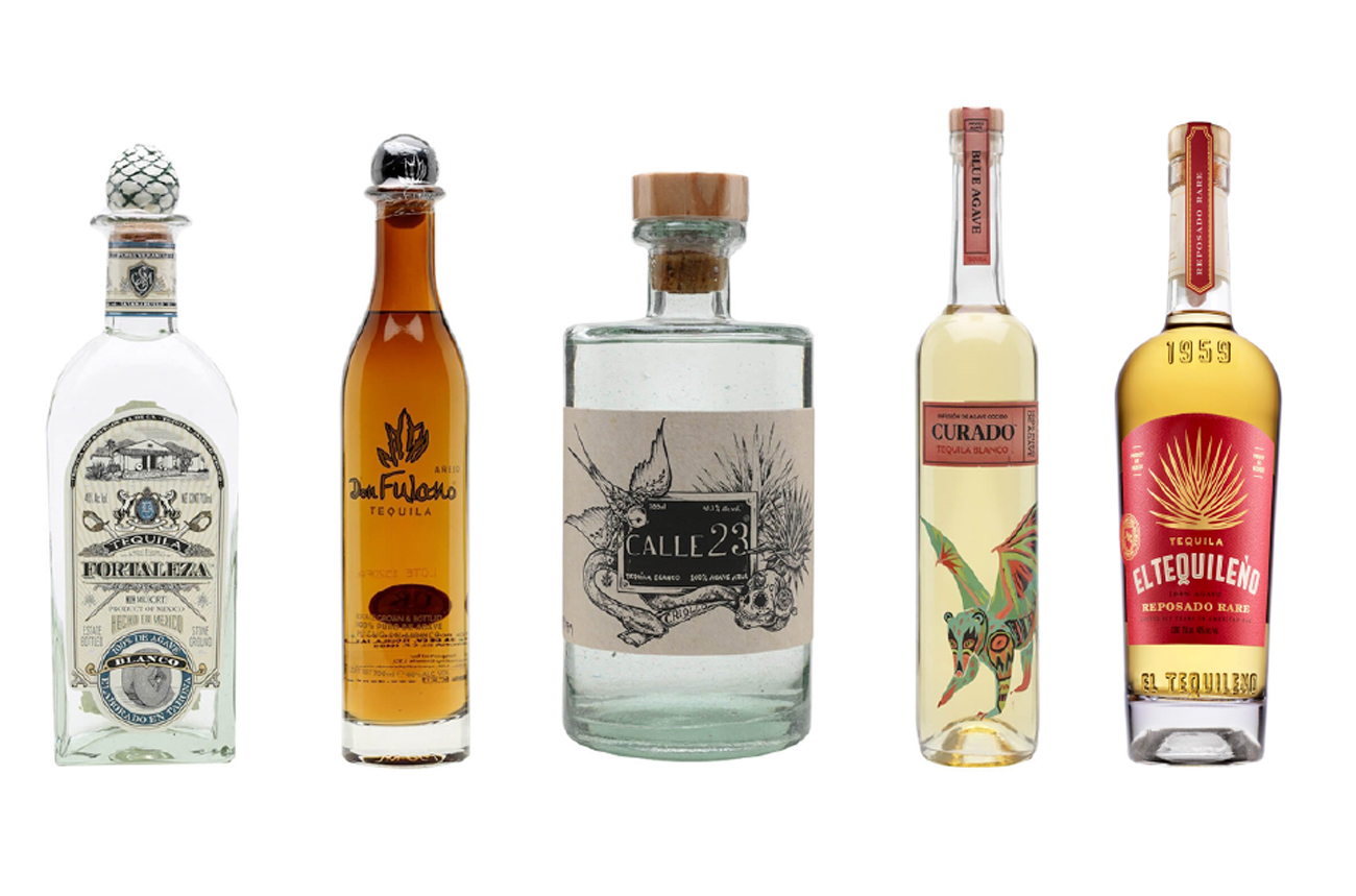 Five bottles of Tequila against a white background