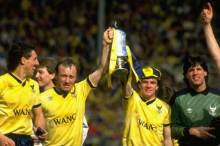 David Langan and Ray Houghton hold the League Cup after Oxford United's victory over QPR in the final, 1986