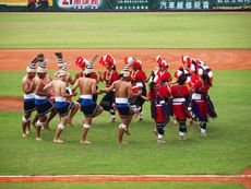 aboriginal taiwanese dance at a baseball game.