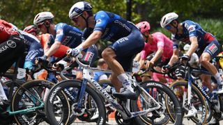 A Groupama FDJ rider racing on a Wilier bike with Miche wheels