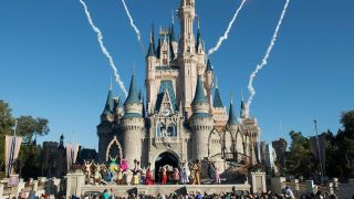 The remnants of fireworks can be seen behind Cinderella's castle during a performance at Disney World.