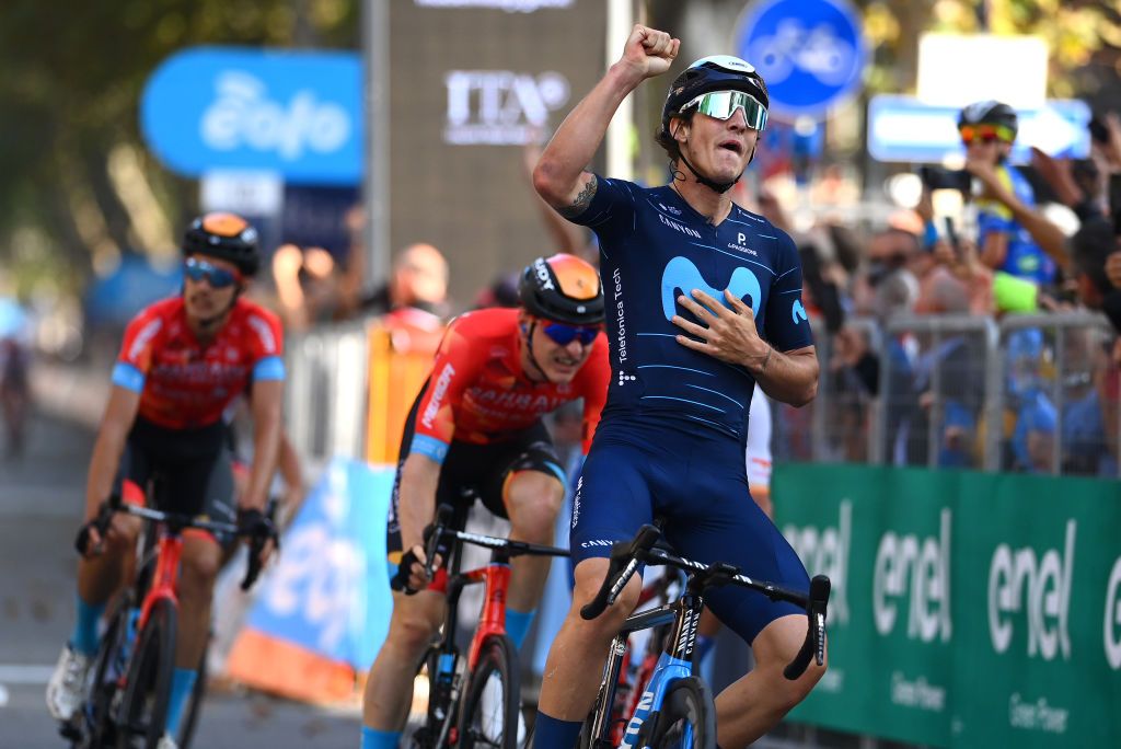 BEINASCO ITALY OCTOBER 06 Ivan Garcia Cortina of Spain and Movistar Team celebrates at finish line as race winner ahead of Matej Mohoric of Slovenia and Team Bahrain Victorious during the 106th Gran Piemonte 2022 a 198km one day race from Omegna to Beinasco GranPiemonte on October 06 2022 in Beinasco Italy Photo by Tim de WaeleGetty Images